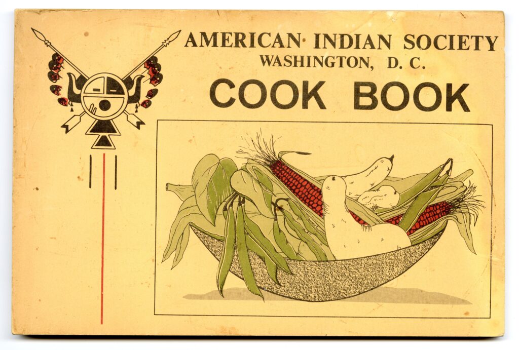 Cover of the American Indian Society Washington DC Cookbook. Illustrated bowl with fruits and vegetables. 