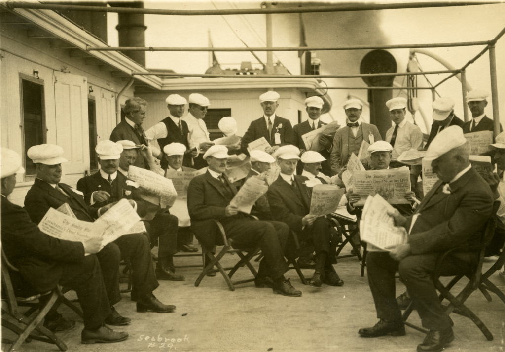 collections image of men reading the newspaper to promote the holiday party and program