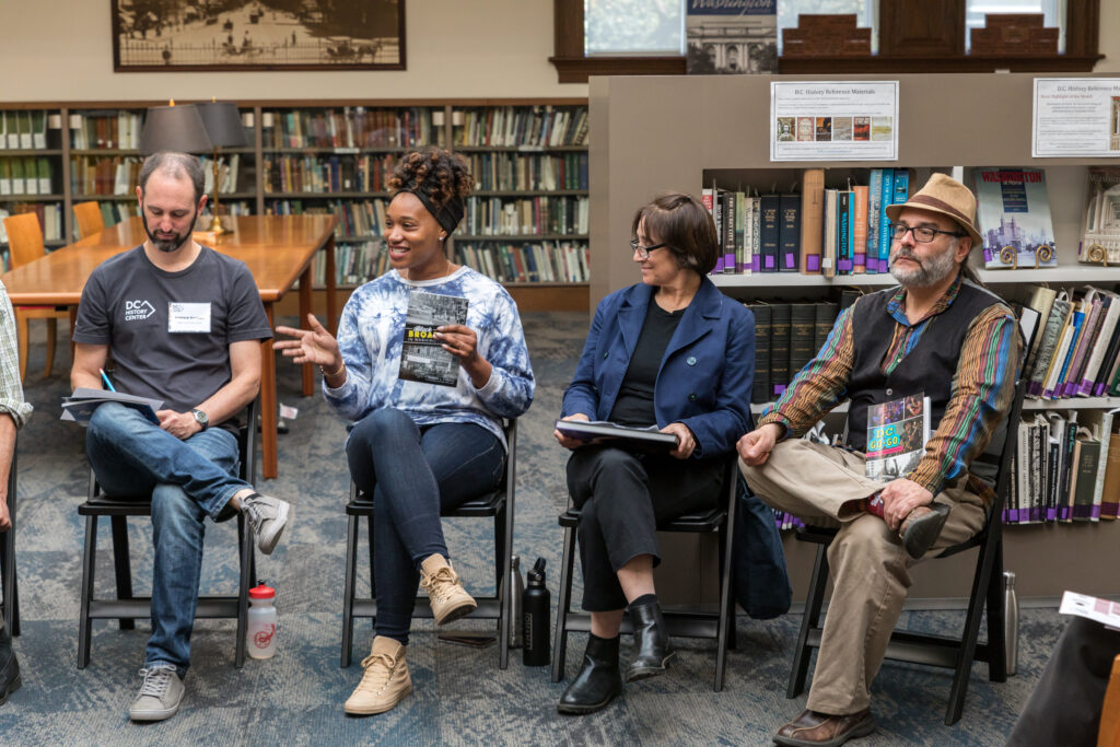 Four people sitting at a book talk during Open Day 2022