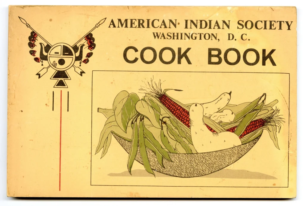 Cover of the American Indian Society Washington DC Cookbook. Illustrated bowl with fruits and vegetables. 