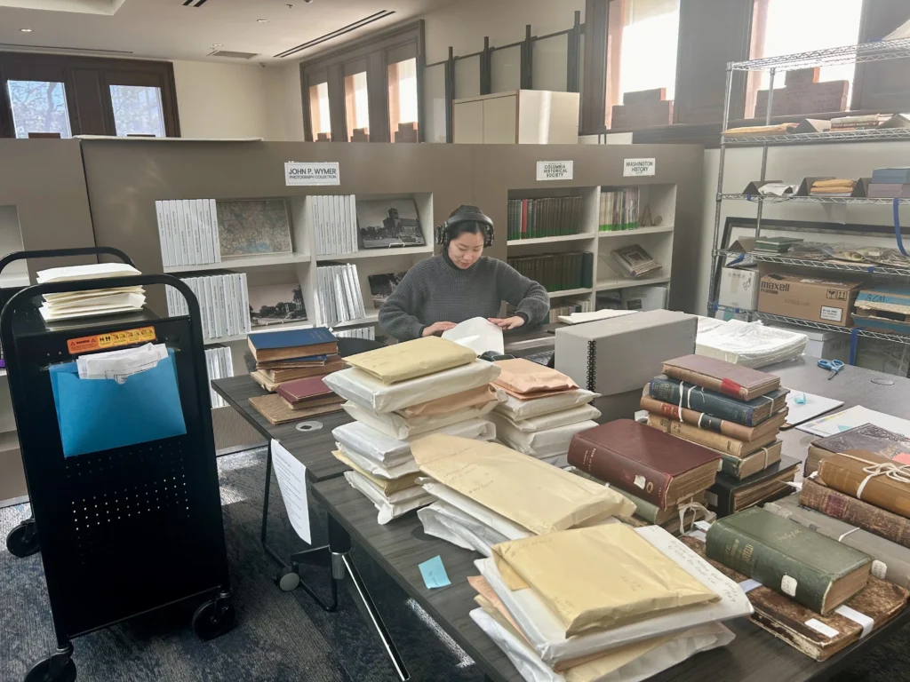 Library Coordinator rehouses delicate books in the Kiplinger Research Library