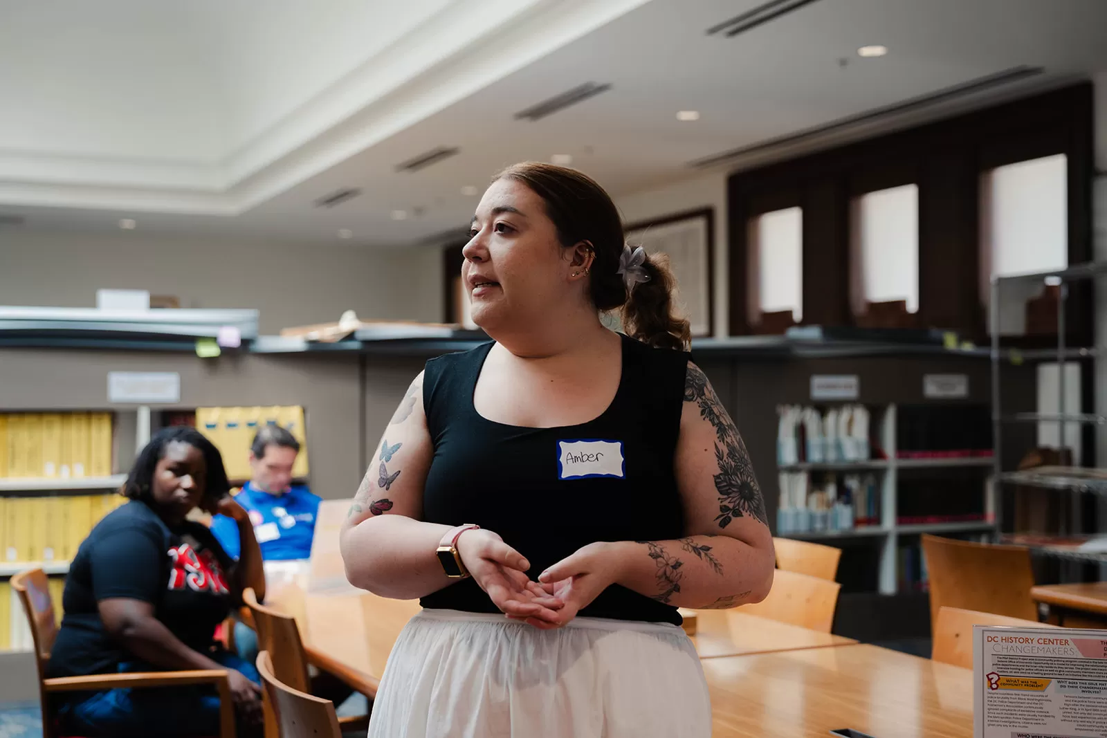 A teacher presents to her fellow Teach the District participants inside the Kiplinger Research Library.